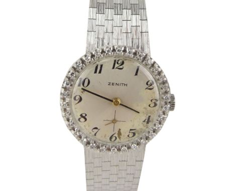 Lady's Vintage Zenith 18 Karat White Gold Bracelet watch with Diamond Bezel. Stamped 18K 750. Case measures 25mm. Bracelet me