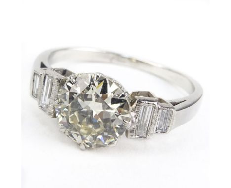 Art Deco Approx. 2.20 Carat Round Brilliant Cut Diamond and Platinum Engagement Ring accented with approx. .30 Carat Baguette