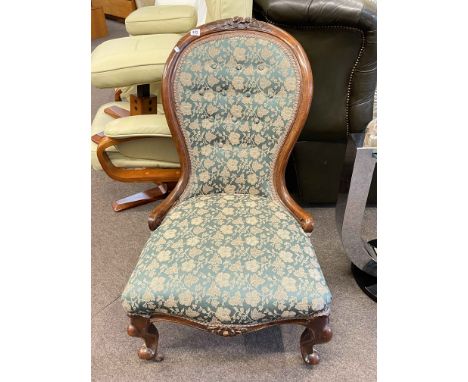 Victorian mahogany framed spoon back nursing chair in green buttoned tapestry fabric.