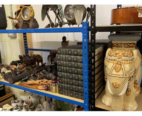 Twenty six volumes of Encyclopedia Britannica, pottery elephant stool, African and Oriental wood carvings, etc.