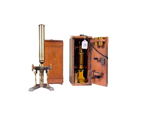 Victorian lacquered brass microscope by R&J Beck and another, both boxed.