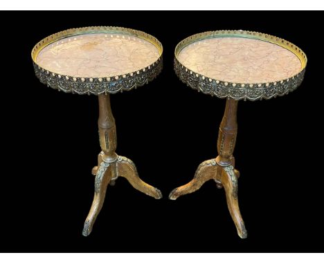 Pair Continental marble inset top and gilt mounted tripod wine tables, 57.5cm by 34cm diameter.