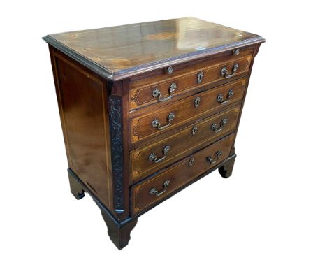 19th Century inlaid mahogany Bachelors chest having brush slide above four graduated long drawers with blind fret quarters on