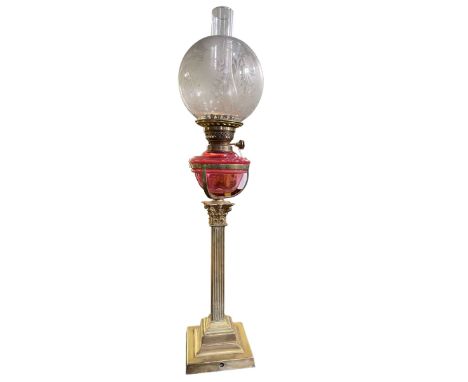 Victorian ruby glass reservoir oil lamp with etched shade.
