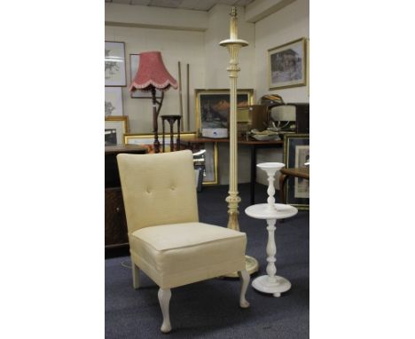 A cream painted carved wooden standard lamp, nursing chair and smokers stand