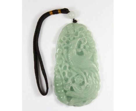 A very fine Chinese jadeite jade amulet carved with a phoenix and a dragon on the reverse H 12cm x 7cm x 1cm. Est. £200 - 300
