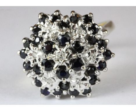 A 9ct gold sapphire and diamond cluster ring (L)