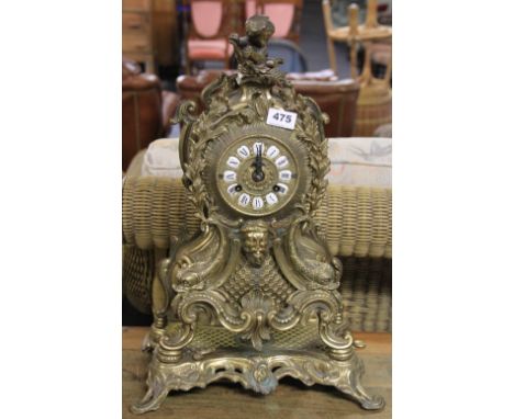 A large brass ornate mantle clock H 52cm