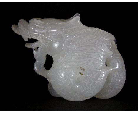 A superb Chinese white jade / hardstone figure of a coiled dragon with enhanced natural features on one side H 9cm x 12cm x 4