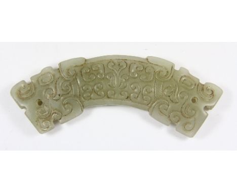 A Chinese archaic form double headed jade dragon amulet W 12cm