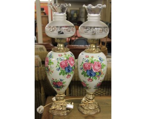A pair of large gilt mounted porcelain oil lamp style electric lights H 74cm