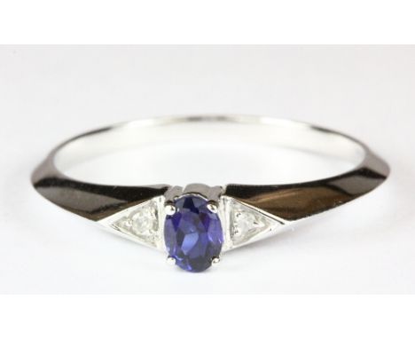 A 10ct white gold sapphire and 2 diamond ring (O)