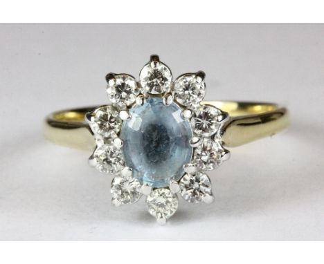 An 18ct gold diamond and aquamarine cluster ring (R)