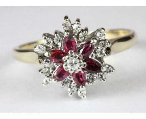 A 9ct gold ruby and diamond cluster ring (L)