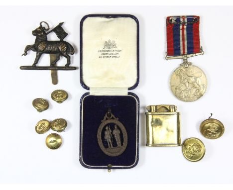 A Trench Art lighter and a quantity of military buttons etc