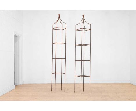 A pair of wrought-iron garden obelisks, of recent manufacture, each with a ball finial, and four tiers united by square suppo