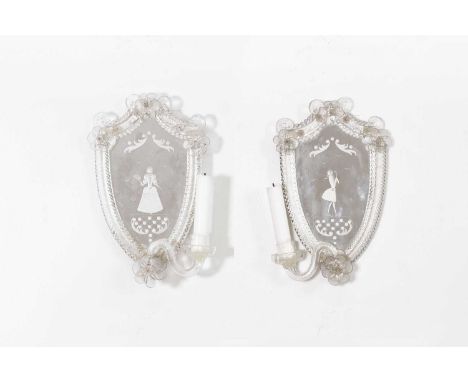 A pair of glass girandole mirrors, 20th century, each shield-shaped plate with an etched figure in 18th-century dress, border