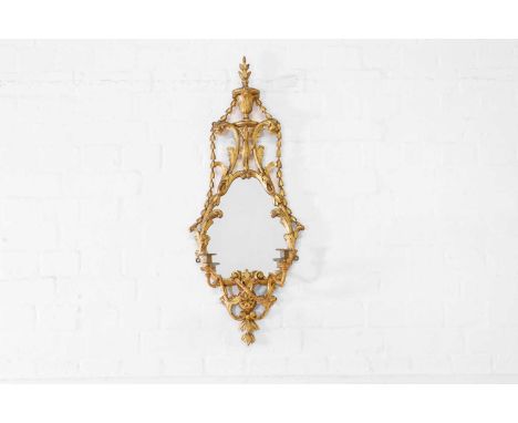 A George III carved giltwood girandole mirror in the manner of William and John Linnell, c.1780, of pierced neoclassical desi