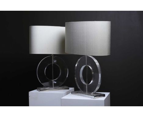 A pair of 'Round Polo' table lamps by Porta Romana, of recent manufacture, each with a Perspex hoop raised on a rectangular p