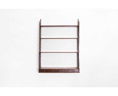 A set of George III mahogany hanging-shelves, late 18th century, in the Chinese Chippendale taste, with four graduated shelve
