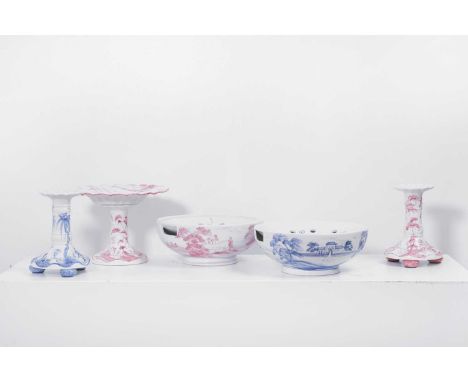 A group of tin-glazed ceramics by Isis Ceramics, late 20th century, comprising two candlesticks, two colander bowls, and a ca