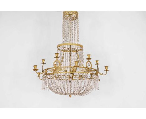 A neoclassical ormolu and cut-glass chandelier, late 18th century and later, Northern European, with twelve sconces and numer