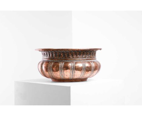 A repoussé copper basin, 17th century, Italian, Tuscany, the gadrooned circular body with a wide moulded rim,30cm diameter14c