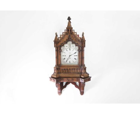 A Victorian Gothic Revival oak bracket clock, c.1870, the silvered dial inscribed 'Clerke, 1 Royal Exchange, London', with a 
