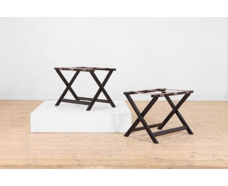 A pair of ebonised wooden luggage stands, 20th century, each of 'X' frame form with brass detail,66cm wide 46cm deep 47cm hig
