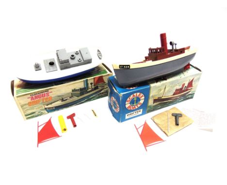 TWO PLASTIC MODEL BOATS comprising a Scalex No.424S, Drifter, with a clockwork motor, complete with masts, key and instructio