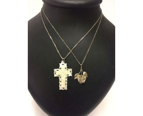 2 pendants on silver chains - one is a cross carved from mother of pearl, measures 4.5cm long.  The other is a rose measuring