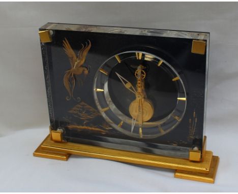 A Jaeger-Le-Coultre Marina desk clock with chinoiserie decoration including a bird of paradise, trees and bull rushes, on a g