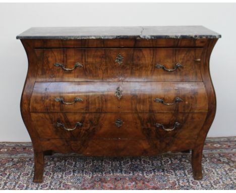 A 20th century continental walnut bombe commode, the marble top above three graduated drawers on splayed feet, 122cm high x 5