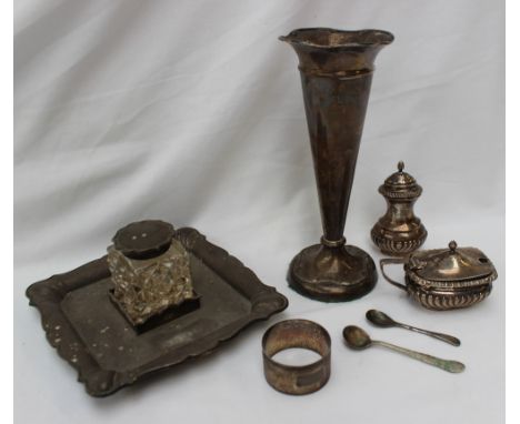 An Edward VII silver desk inkstand, of square form with a shaped edge, and glass inkwell, London, 1908, together with a silve