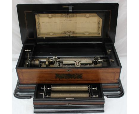A Swiss rosewood inlaid interchangeable music box, the 28cm cylinder playing one of eight melodies on a comb, side wound mech