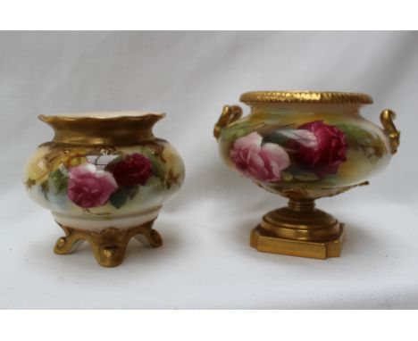 A Royal Worcester porcelain twin handled vase of squat form painted with roses and leaves to an ivory ground with gilt highli