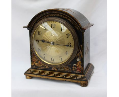 A chinoiseie decorated desk clock, with a domed top decorated with pagodas and figures to a black ground, the gilt sun burst 