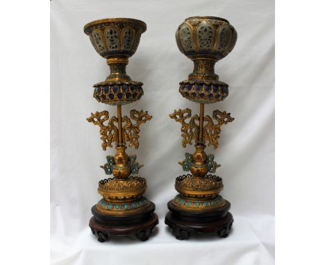 A matched pair of Chinese Buddhistic gilt and enamel decorated altarpieces, with a gilt bowl inset with carved jade panels, a