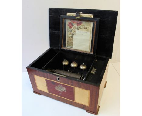 A music box with a 15.5cm cylinder, playing on three bells, 41.5cm wide x 26cm deep x 22cm high    CONDITION REPORT:  In poor