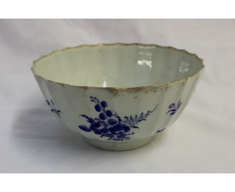 An 18th century Worcester porcelain slops basin,  with a raised rim and numerous panels painted with sprays of garden flowers