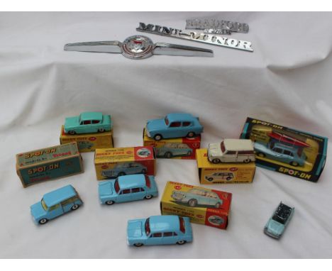 A Spot-On No.274 Morris 1100 and canoe model car, boxed, together with a Spot-On Ford Anglia, Dinky 155 Ford Anglia, Dinky 14