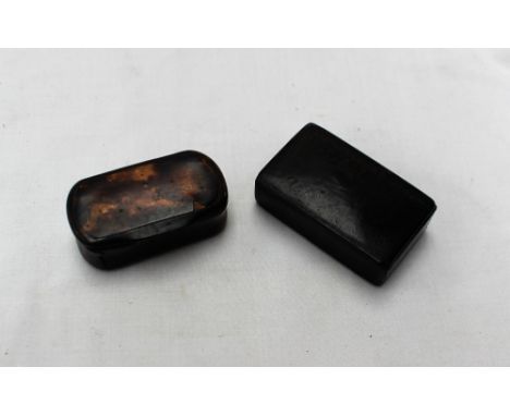 A papier mache snuff box, inset with tortoiseshell, 5cm wide together with another snuff box