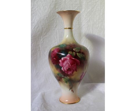 A Royal Worcester porcelain baluster vase decorated with roses to an ivory ground on a spreading foot, green printed mark and