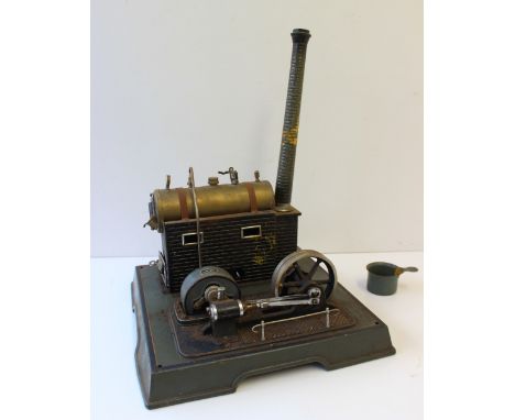 A Marklin Live Steam Stationary Engine consisting of horizontal brass boiler, mounted on brick effect stand with chimney, con