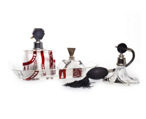 THREE ART DECO GLASS PERFUME ATOMISERSall of angular shape and flashed with ruby and black panels also a small trinket tray, 