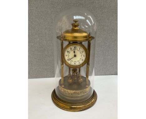 An oversized anniversary clock, suspended pendulum, Arabic dial, overall height 43cm tall 