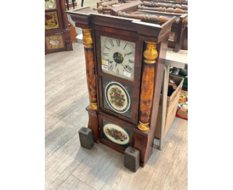 A circa 1900 American wall clock, glazed decorative panels, Roman dial, pillar detail, with pendulum and weight 