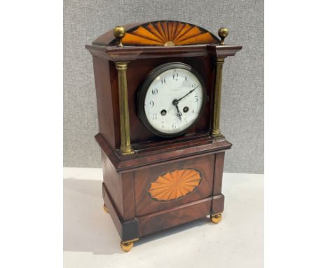 An Edwardian mahogany mantel clock of architectural form, painted enamel face marked London, with pendulum 
