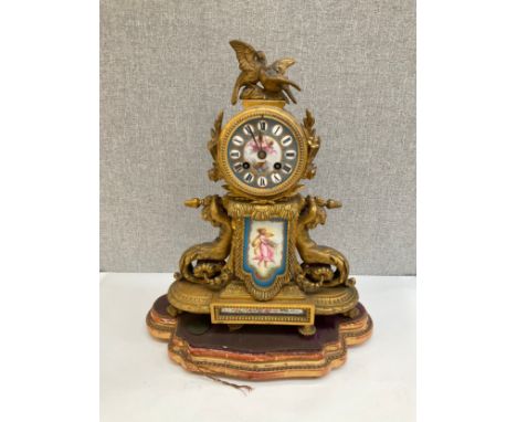 A 19th Century ormolu and Sevres style panel figural mantel clock with merman style mounts, on gilt wood beaded stand, P. Mon