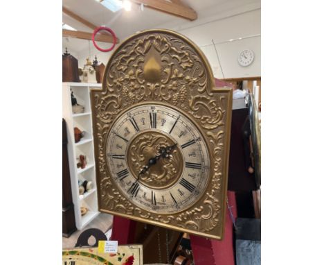 A French comtoise style wall clock with embossed grape and vine face, Roman numerated silver dial, 35cm tall x 27cm wide, wit